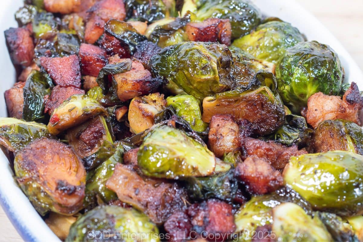 Roasted Brussels Sprouts with Pancetta in a baking dish right out of the oven.