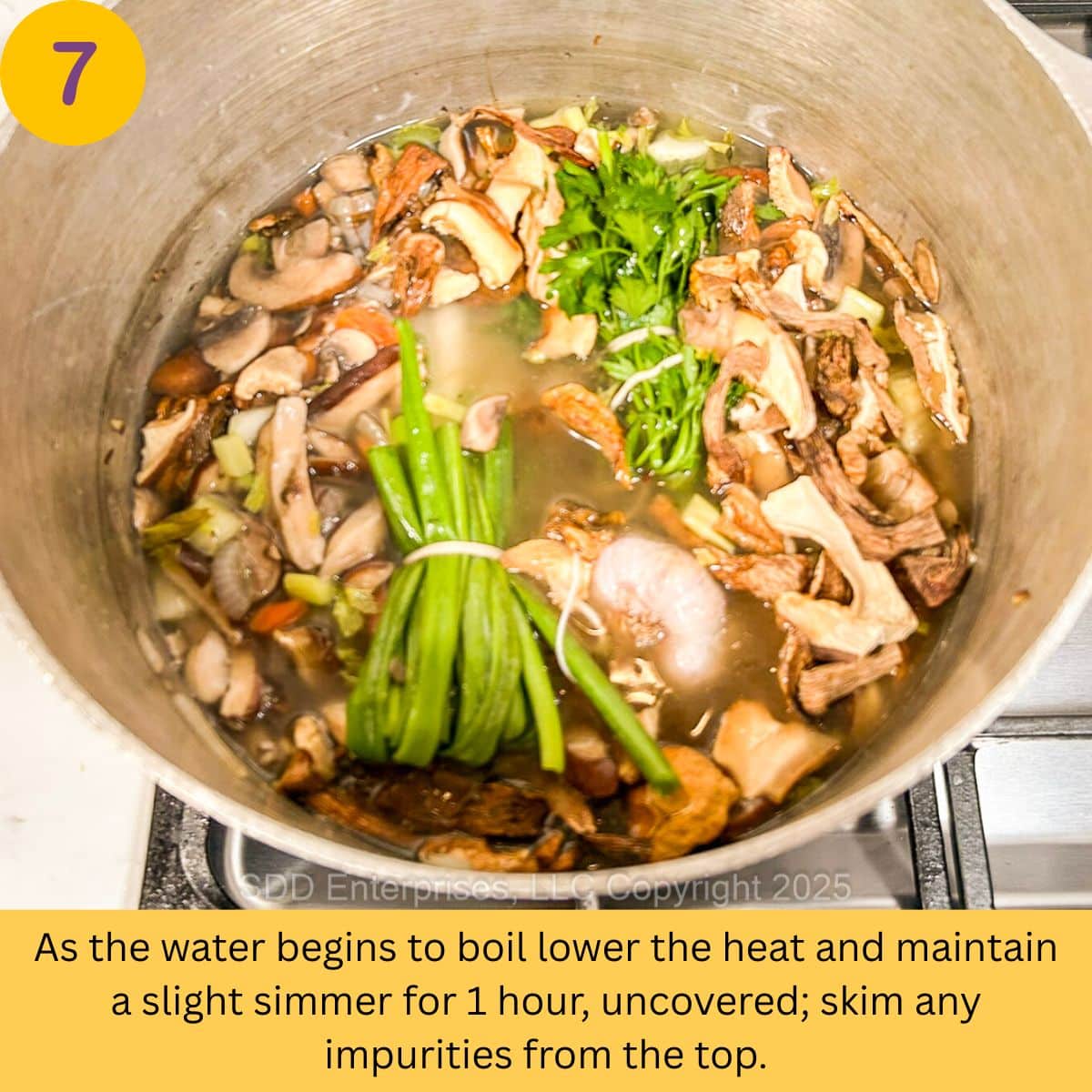 Mushroom Stock simmering in a stock pot.
