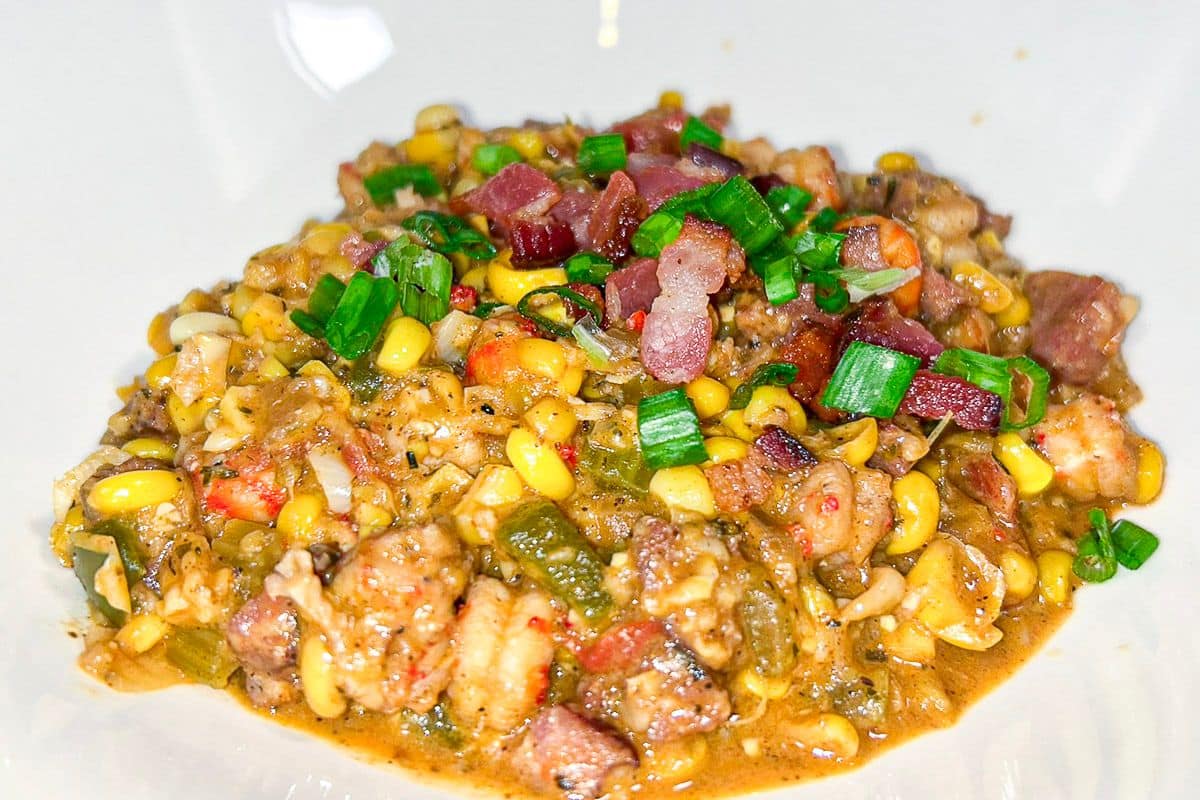 Crawfish Maque Choux in a white bowl.