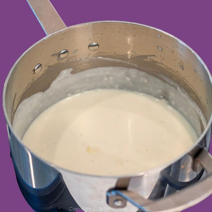 Béchamel Sauce in a stainless steel sauce pan.