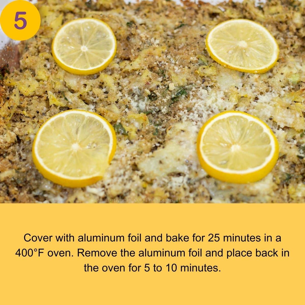 Stuffed Artichoke Casserole topped with lemon slices right out of the oven.