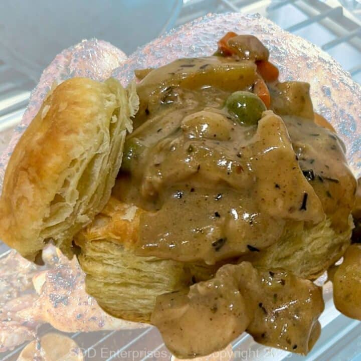 Turkey Pot Pie filling in a puff pastry overlaid on a roasted turkey.