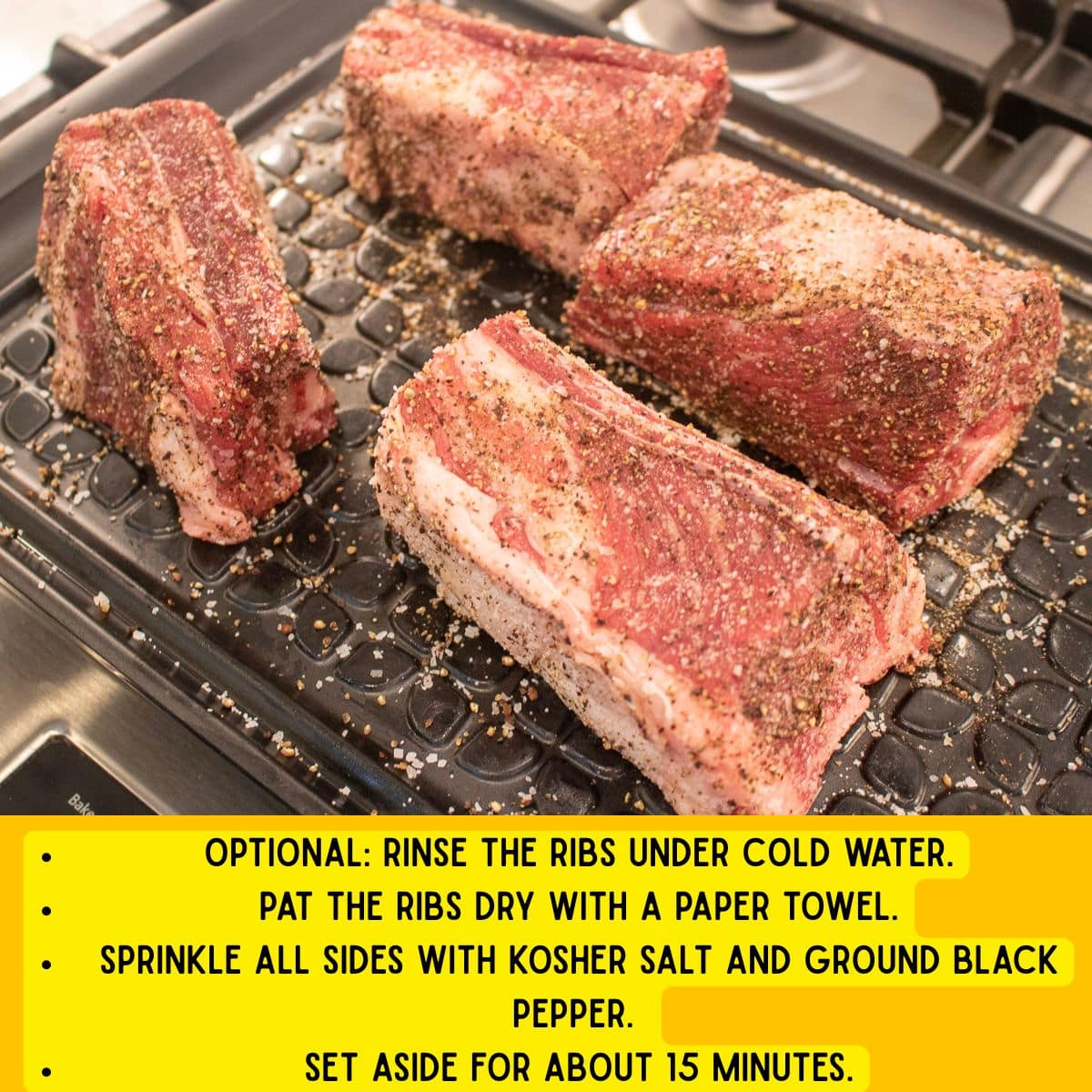 Seasoned short ribs on a prep platter.