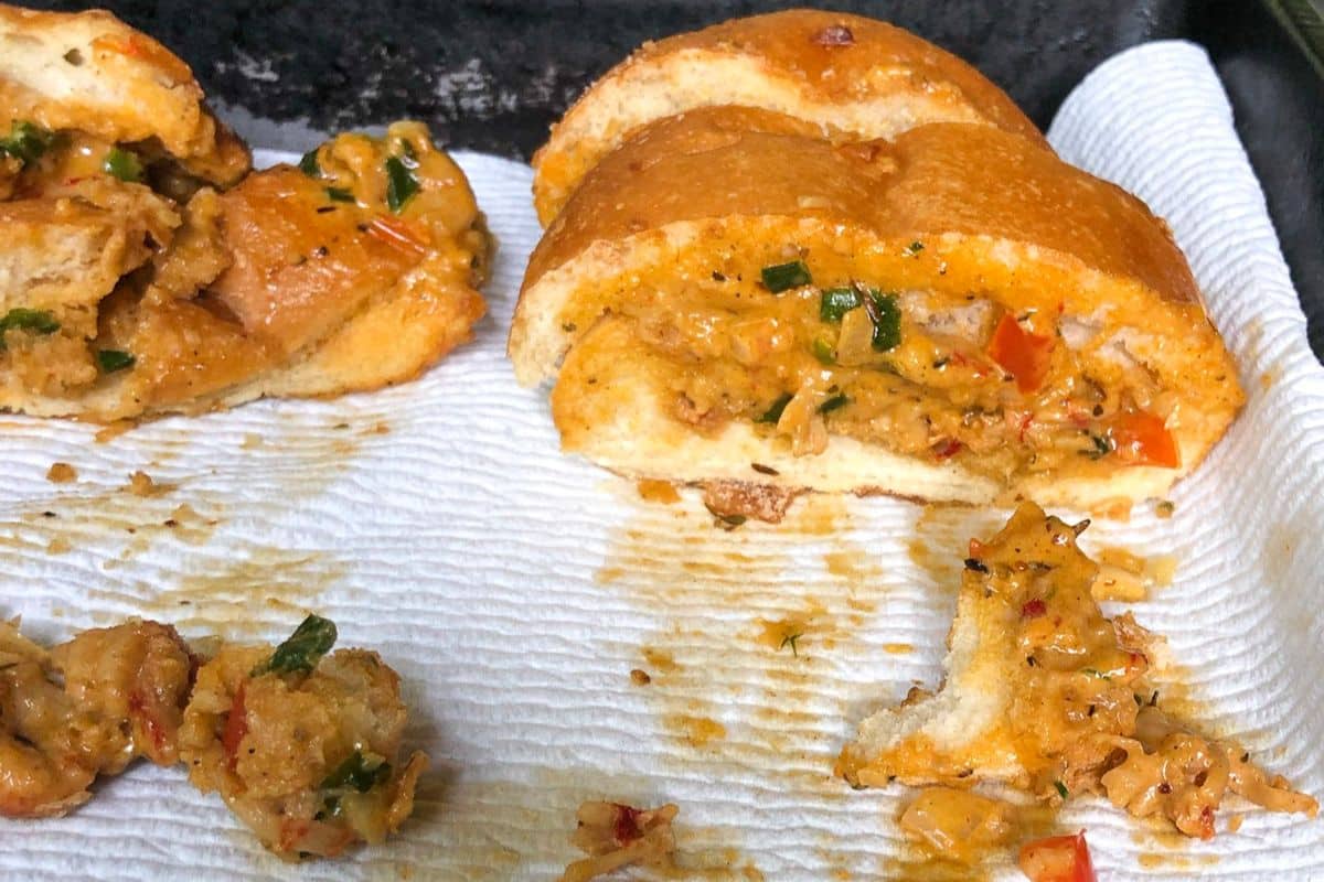 Crawfish bread sliced into pieces and served on a tray.
