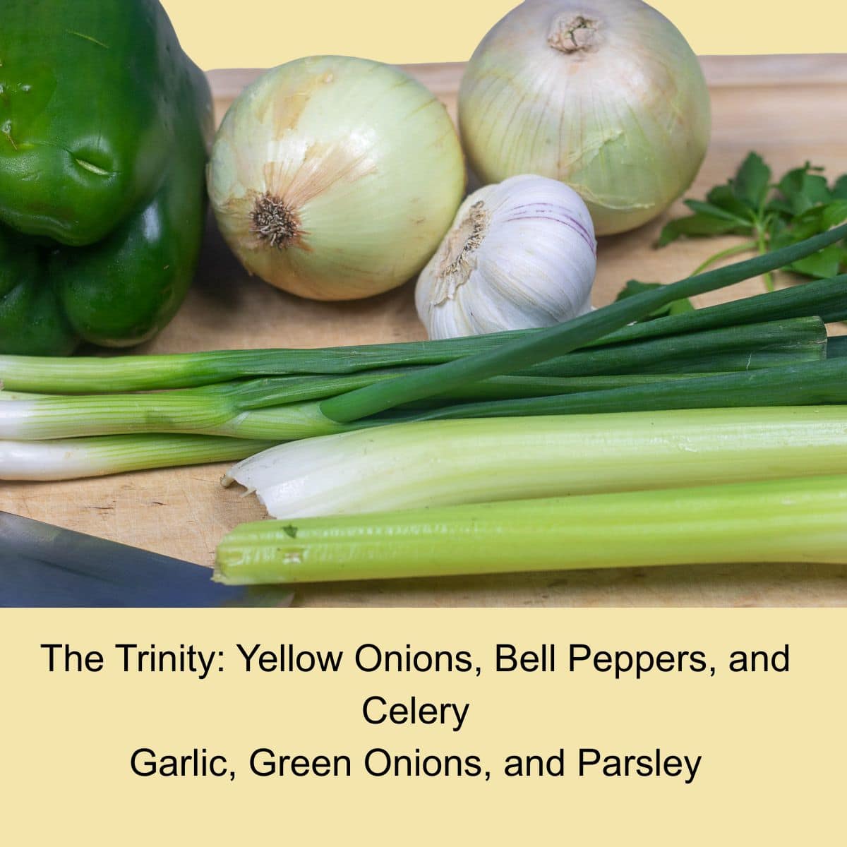 Ingredients for crawfish pie including onion, bell pepper, celery and garlic.