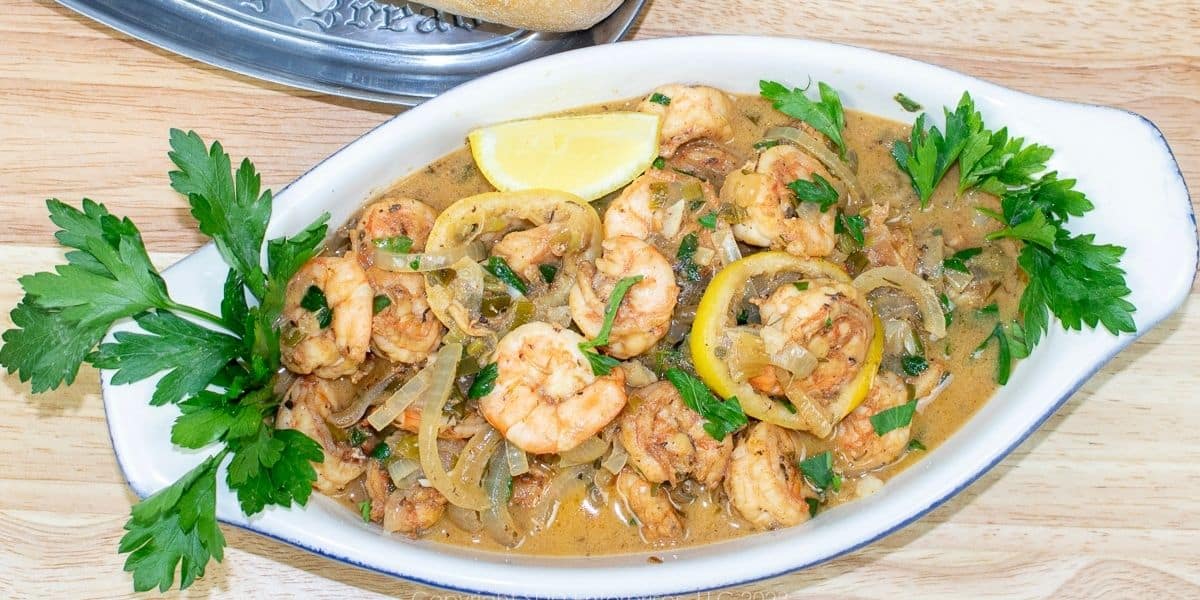 Shrimp in white wine butter sauce served with French bread for dipping.