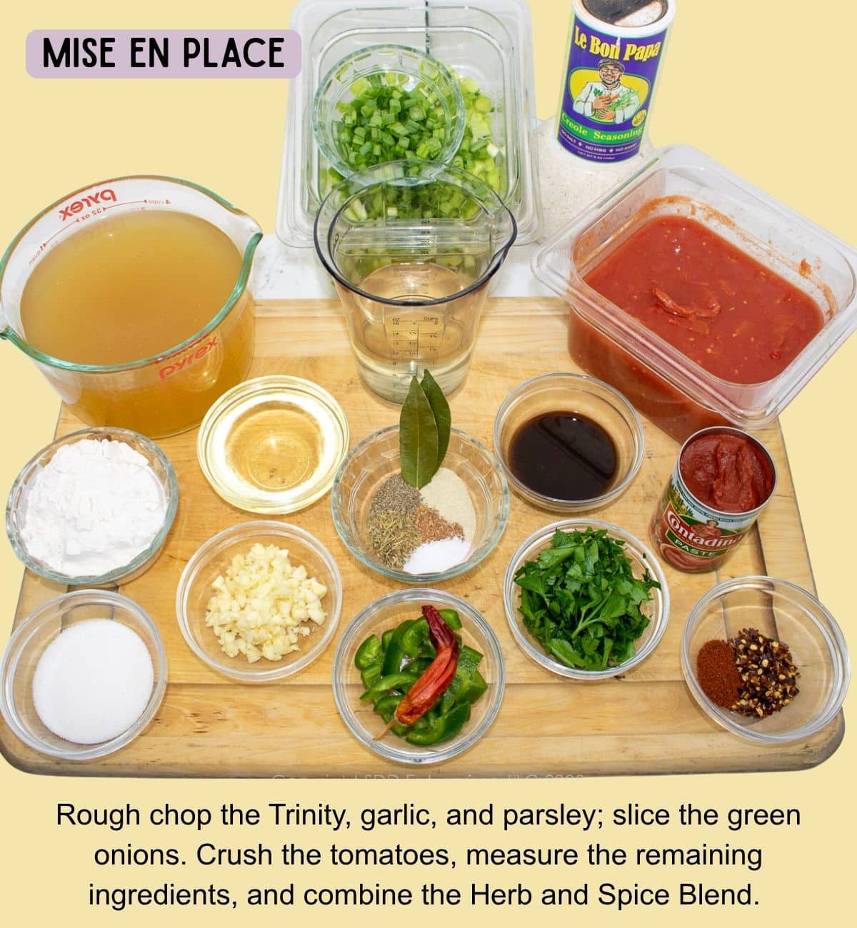 Prepared vegetables, tomatoes, seasonings, and measured ingredients arranged for Chicken Sauce Piquante.