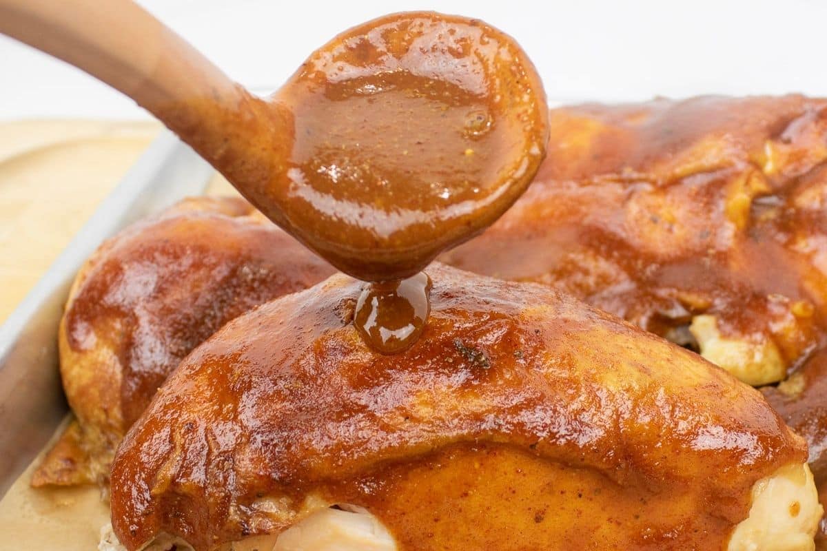 Homemade Cajun BBQ Sauce served with grilled chicken.