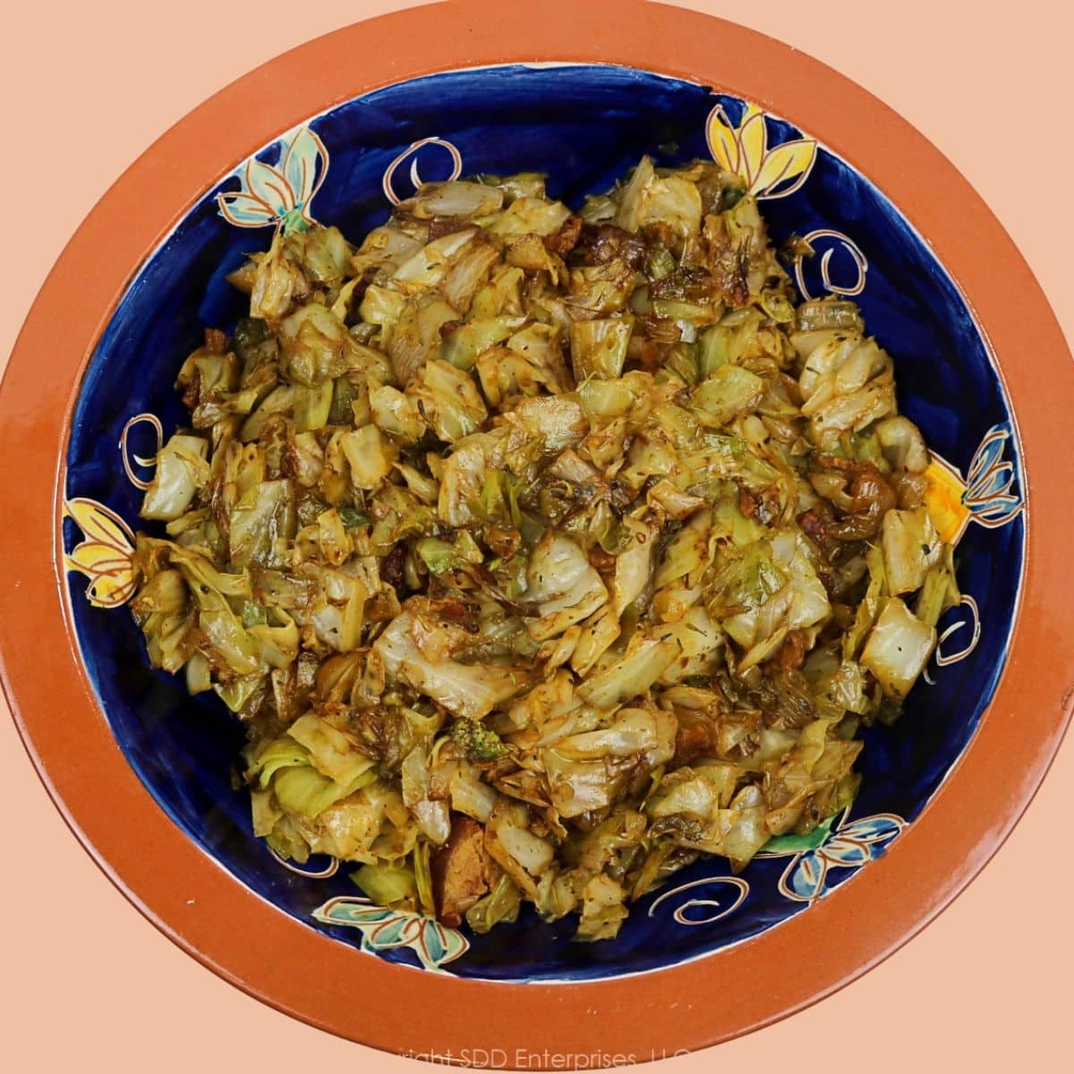 Finished fried cabbage with bacon, onions, and cane syrup.