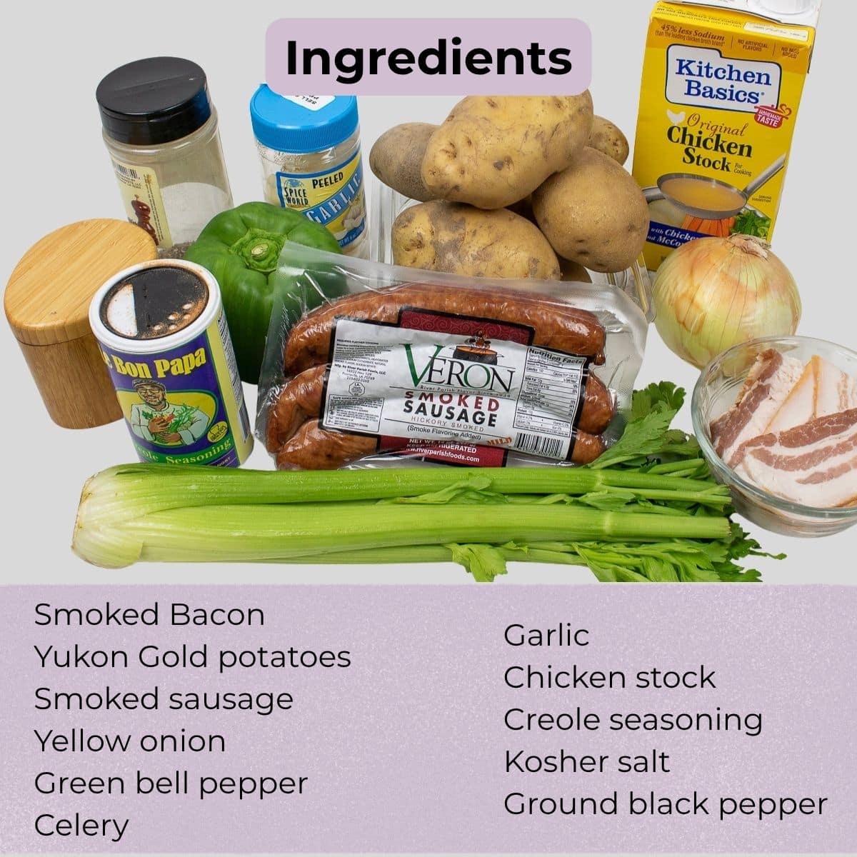 Ingredients for Cajun smothered potatoes and sausage, including Yukon Gold potatoes, smoked sausage, bacon, Trinity vegetables, garlic, stock, and seasonings.