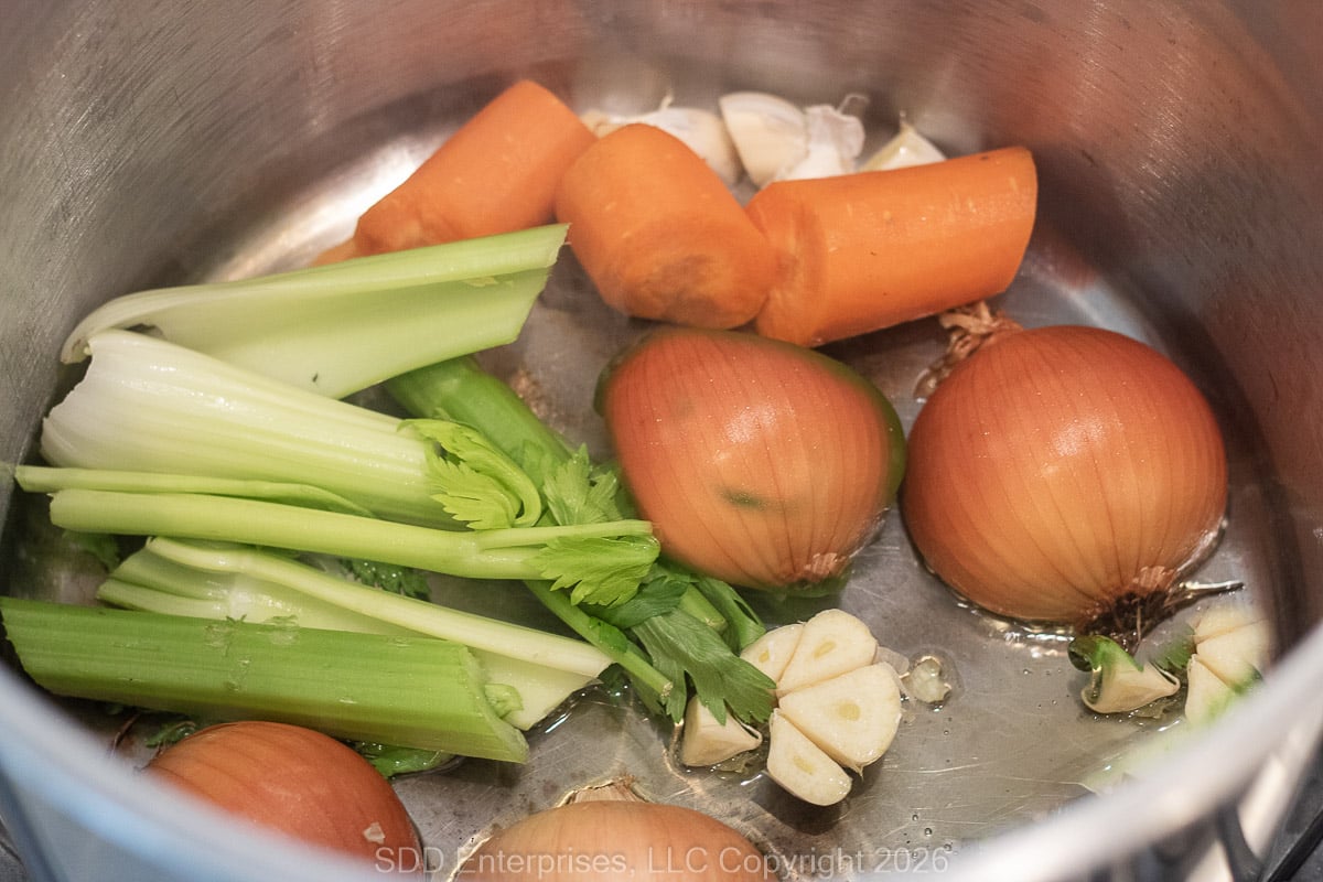 Ingredients for turkey stock in a large stock pot.